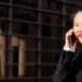 asiatic businesswoman walking talking by phone
