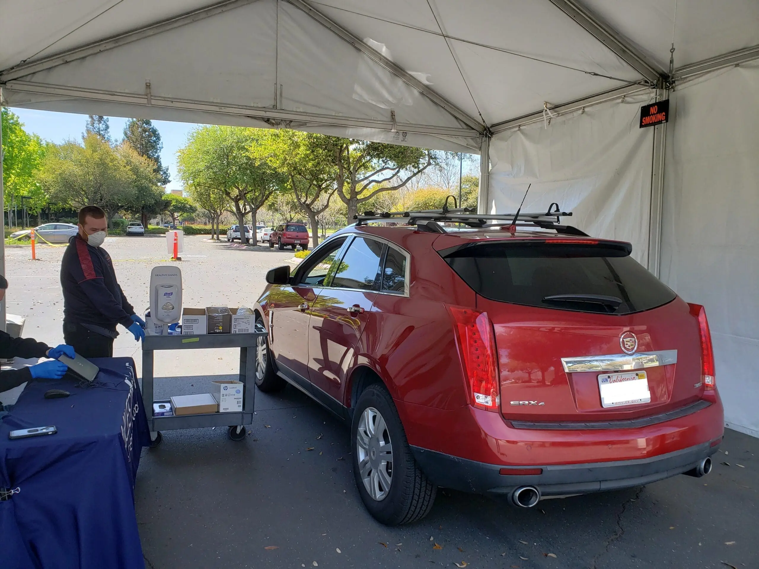 Employee using a drive-through IT service desk from Milestone Technologies