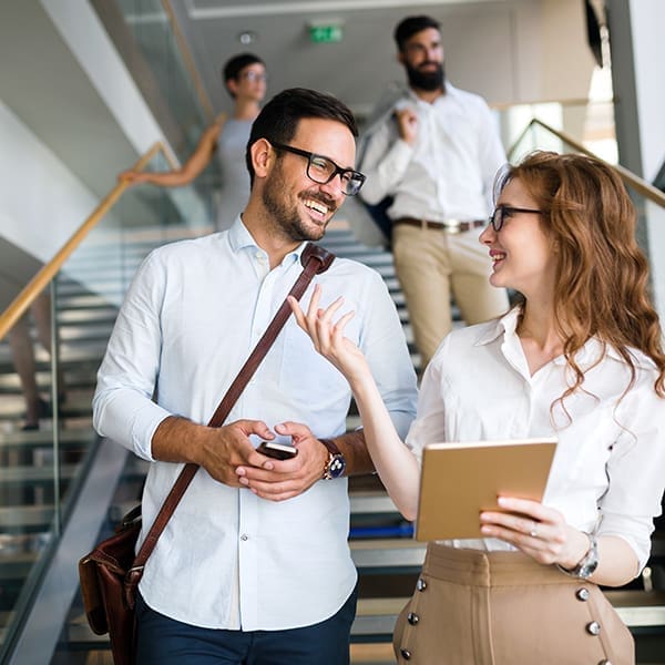 Business people having fun and chatting at workplace office