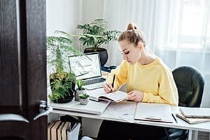 Job search websites. Job Search Engines and Boards. Young Student woman browsing work opportunities online using job search web sites and applications in home.Job search websites. Job Search Engines and Boards. Young Student woman browsing work opportunities online using job search web sites and applications in home.